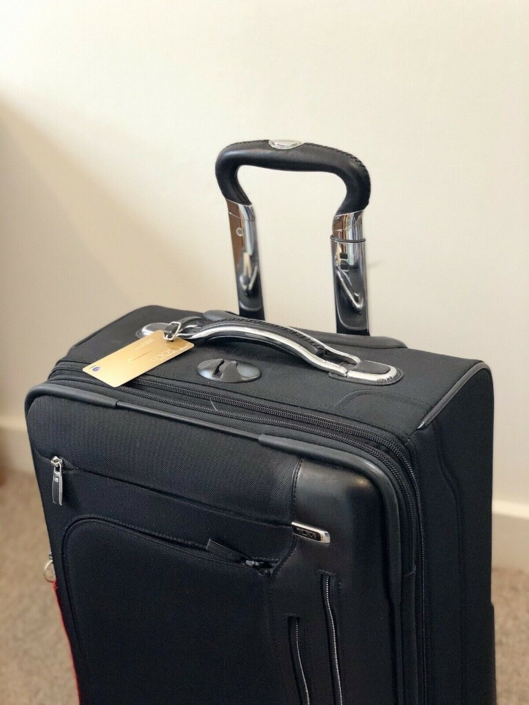 tumi arrive international carry on